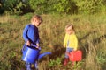 Little boy and girl working in the garden Royalty Free Stock Photo