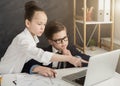 Little boy and girl working on laptop Royalty Free Stock Photo