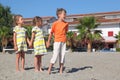 Little boy and girls standing on beach Royalty Free Stock Photo