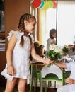 Little boy gives flowers to his little friend. Royalty Free Stock Photo