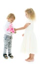 A little boy gives a girl a bouquet of flowers. The concept of l Royalty Free Stock Photo