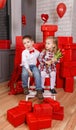 Little boy gives a girl flowers. Happy romantic little couple kids. Royalty Free Stock Photo