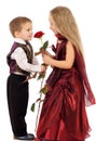 Little boy gives a girl a rose