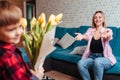 a little boy gives his mother flowers Royalty Free Stock Photo