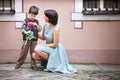 Little boy giving flower to his mom Royalty Free Stock Photo