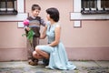 Little boy giving flower to his mom Royalty Free Stock Photo