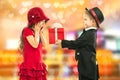 Little boy giving girl gift and his excited Royalty Free Stock Photo