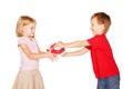 Little boy giving a little girl a gift. Royalty Free Stock Photo