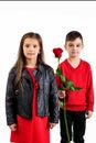 Little boy giving a red rose to child girl Royalty Free Stock Photo