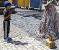 Little boy and goat toy in the square,madrid