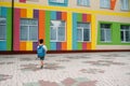 Little boy going back to school. Child with backpack and books on first school day. Back view. School concept. Back to Royalty Free Stock Photo