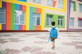 Little boy going back to school. Child with backpack and books on first school day. Back view. School concept. Back to Royalty Free Stock Photo
