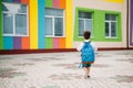 Little boy going back to school. Child with backpack and books on first school day. Back view. School concept. Back to Royalty Free Stock Photo