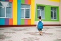 Little boy going back to school. Child with backpack and books on first school day. Back view. School concept. Back to Royalty Free Stock Photo