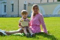 Little boy on the grass with her mother in the summer park Royalty Free Stock Photo