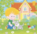 Little boy with a grey kitten on a lawn