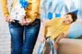 Little boy guessing birthday present from his mother