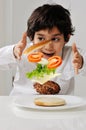 Little boy with hamburger Royalty Free Stock Photo