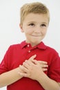 Little Boy With Hand On Heart Royalty Free Stock Photo