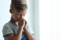 Little boy with hands clasped together for prayer Royalty Free Stock Photo