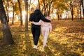 Little boy on hands of father on family autumn walk through countryside. Happy family mother, father and child son on Royalty Free Stock Photo