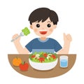 A Little Boy happy to eat salad. He love vegetables. Healthy foods with benefits. Royalty Free Stock Photo