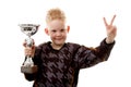 Little boy has won the second place trophy cup