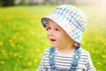 Little boy in hat standing on the field Royalty Free Stock Photo