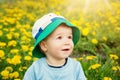 Little boy in hat standing on the field Royalty Free Stock Photo