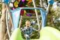 Little boy having fun on a playground outdoors in summer. Toddler on a slide. Royalty Free Stock Photo