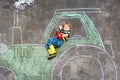 Little boy having fun with tractor picture drawing Royalty Free Stock Photo