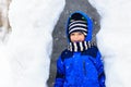 Little boy having fun in winter snow Royalty Free Stock Photo