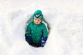 Little boy having fun in winter snow Royalty Free Stock Photo