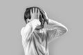 Little boy having a headache. Despair, tragedy. Portrait of a sad boy holding his head with his hand, isolated on the Royalty Free Stock Photo