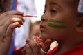 Little boy having his face painted Kids having fun playing Royalty Free Stock Photo