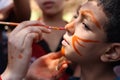 Little boy having his face painted Kids having fun playing Royalty Free Stock Photo