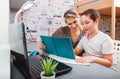 Little boy having lessons with tutor at home. Elementary school tutor Royalty Free Stock Photo