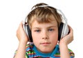 Little boy and in headphone puts hands on it Royalty Free Stock Photo