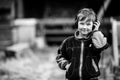 Little boy in headphones, outdoors. Black and white photography. Royalty Free Stock Photo