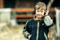 Little boy in headphones outdoors. Walk. Royalty Free Stock Photo