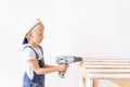 Little boy in a helmet plays in the builder with tools.  over white Royalty Free Stock Photo