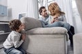 Little boy hiding while his parents hugging and talking Royalty Free Stock Photo