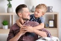 Little boy and his dad spending time together at home Royalty Free Stock Photo
