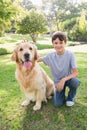 Little boy with his dog in the park Royalty Free Stock Photo