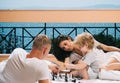 Little boy and his father with mother playing chess Royalty Free Stock Photo