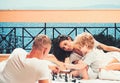 Little boy and his father with mother playing chess Royalty Free Stock Photo