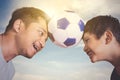 Little boy and his father playing football together Royalty Free Stock Photo