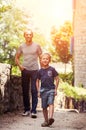 Little boy with his father walk together