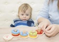 Little boy and his mom play in developing the game Royalty Free Stock Photo