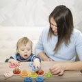 Little boy and his mom play in developing the game Royalty Free Stock Photo